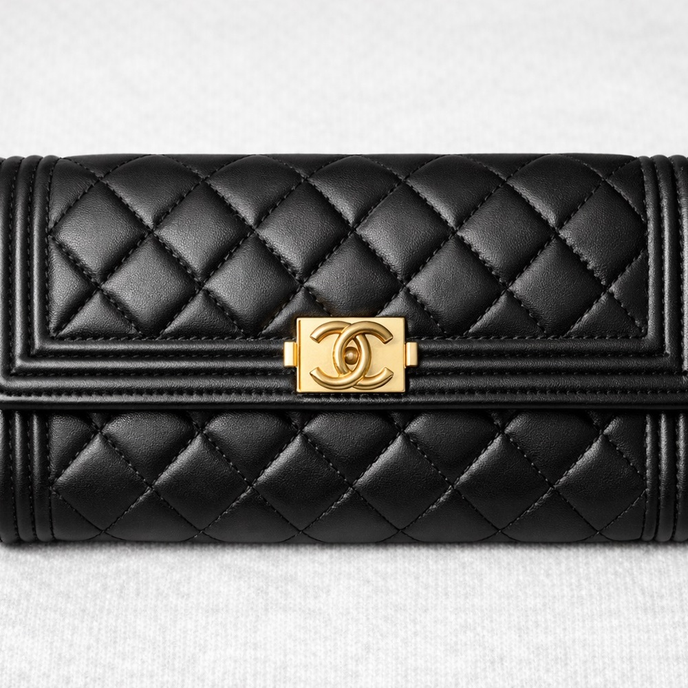 CHANEL Black Quilted Clutch with Gold Accent